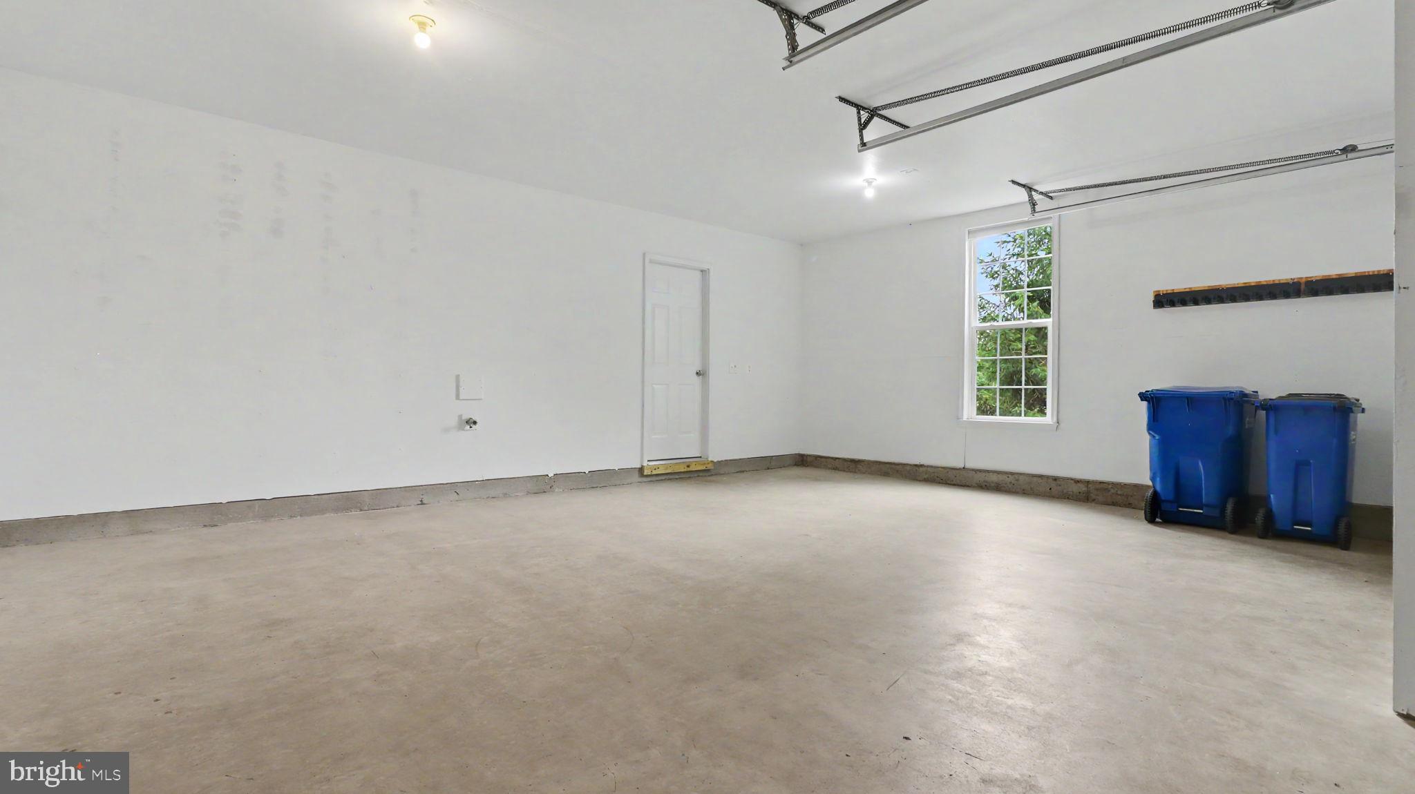 42371 Trellis Square Brambleton, VA 20148 - Photo 6 of 70 Spacious, versatile garage space.