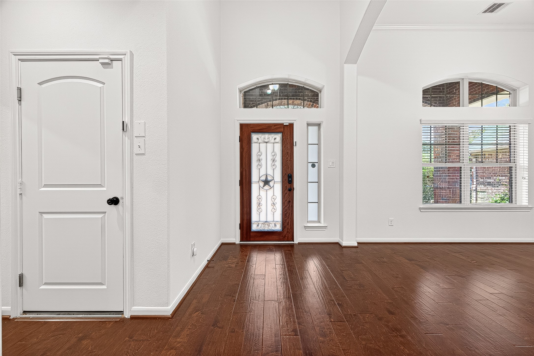 138 South Sawbridge Circle Spring, TX 77389 - Photo 3 of 37 a view of a hallway with wooden floor and entryway