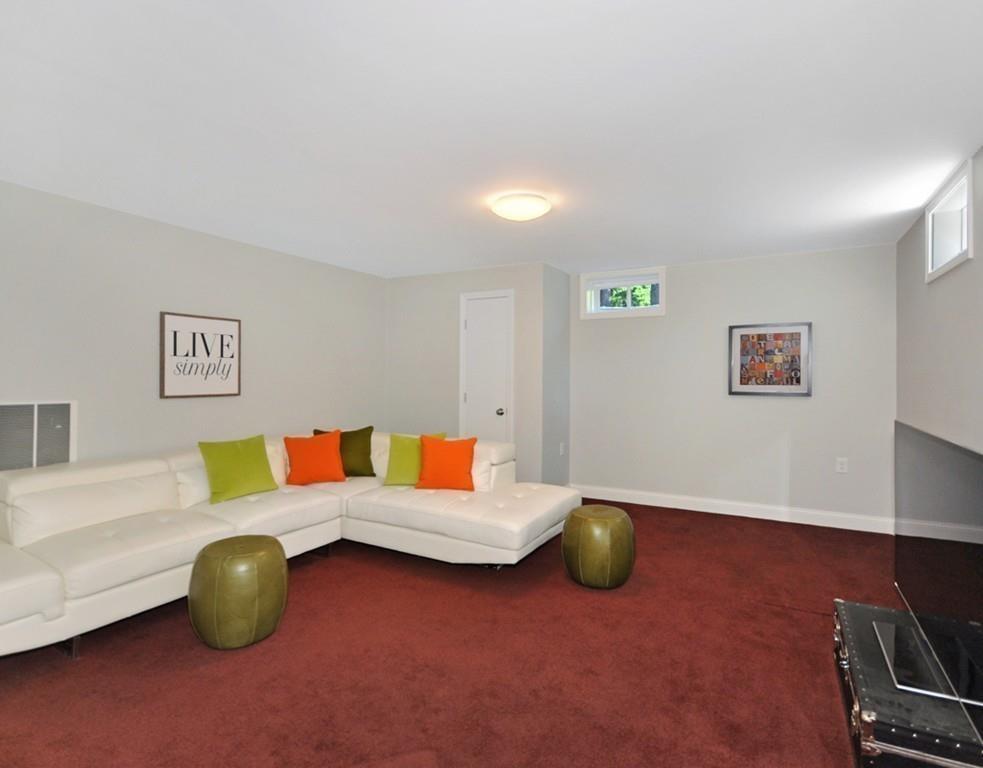 30 Nancy Road Concord, MA 01742 - Photo 20 of 26 a living room with furniture and gym equipment