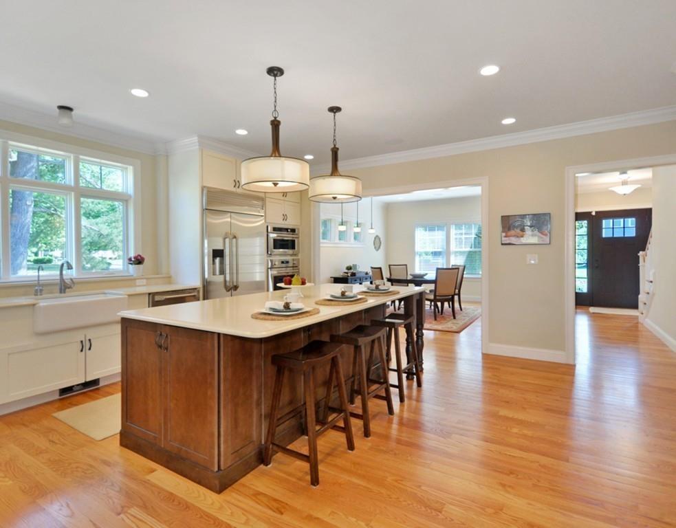 30 Nancy Road Concord, MA 01742 - Photo 6 of 26 a large kitchen with a table and chairs