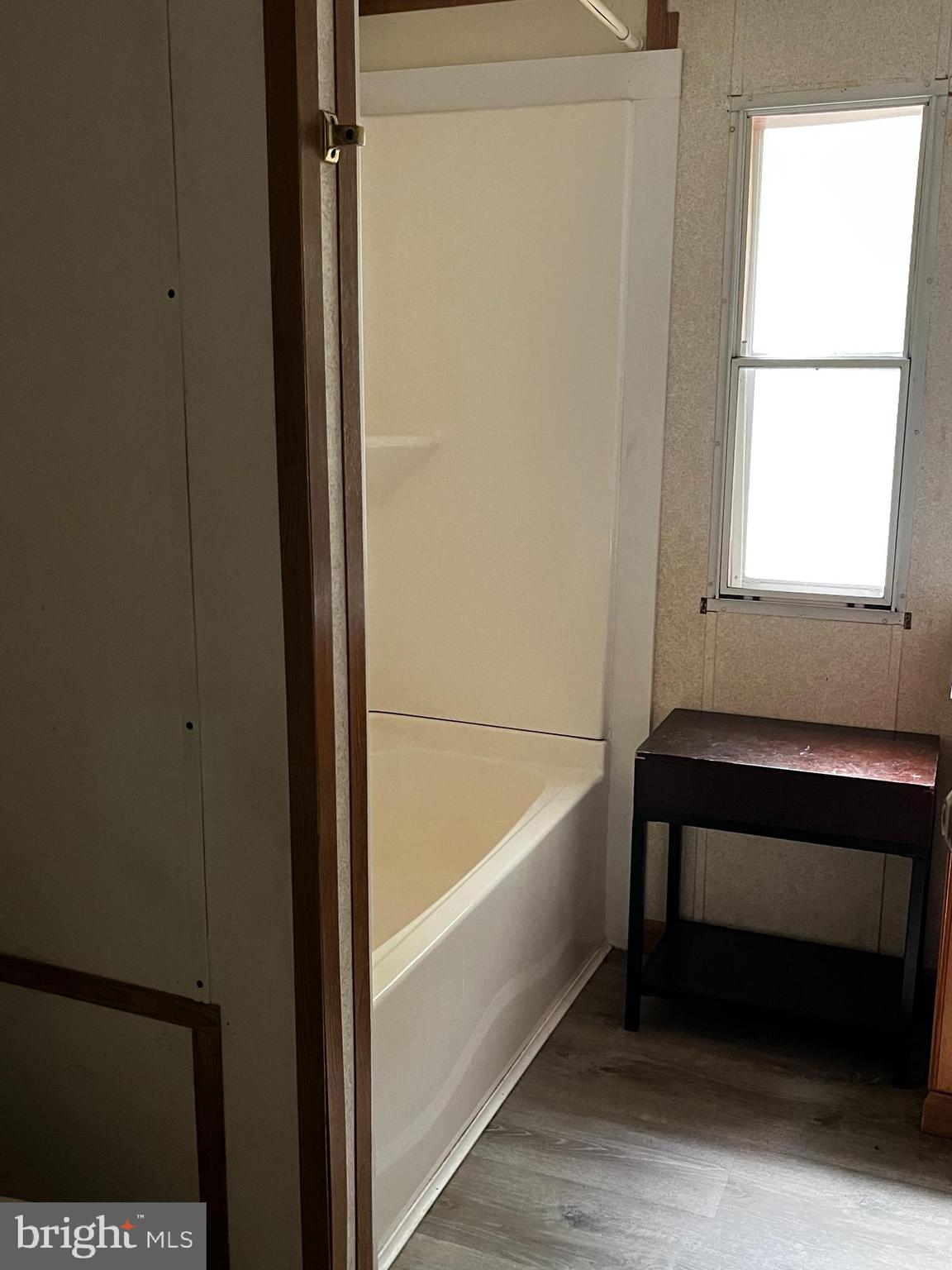 11240 Curt Dogg Road Lincoln, DE 19960 - Photo 11 of 14 a bathroom with a bathtub and a window