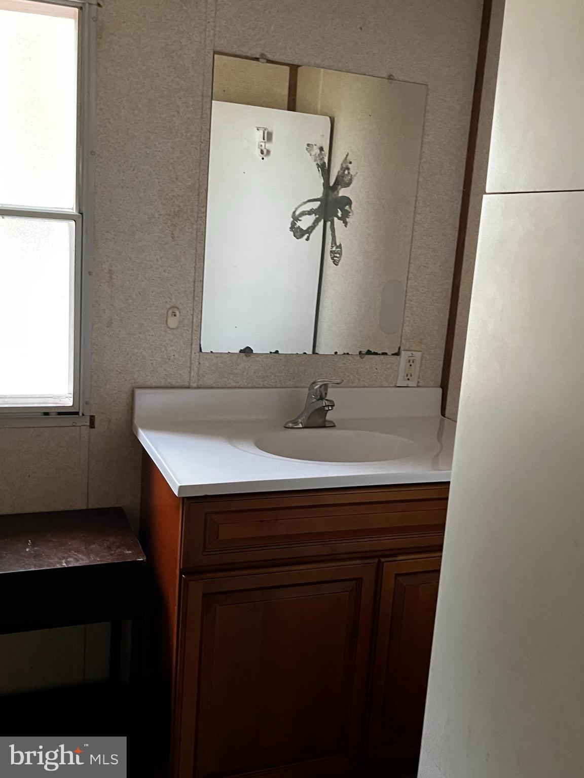 11240 Curt Dogg Road Lincoln, DE 19960 - Photo 12 of 14 a bathroom with a sink and a mirror