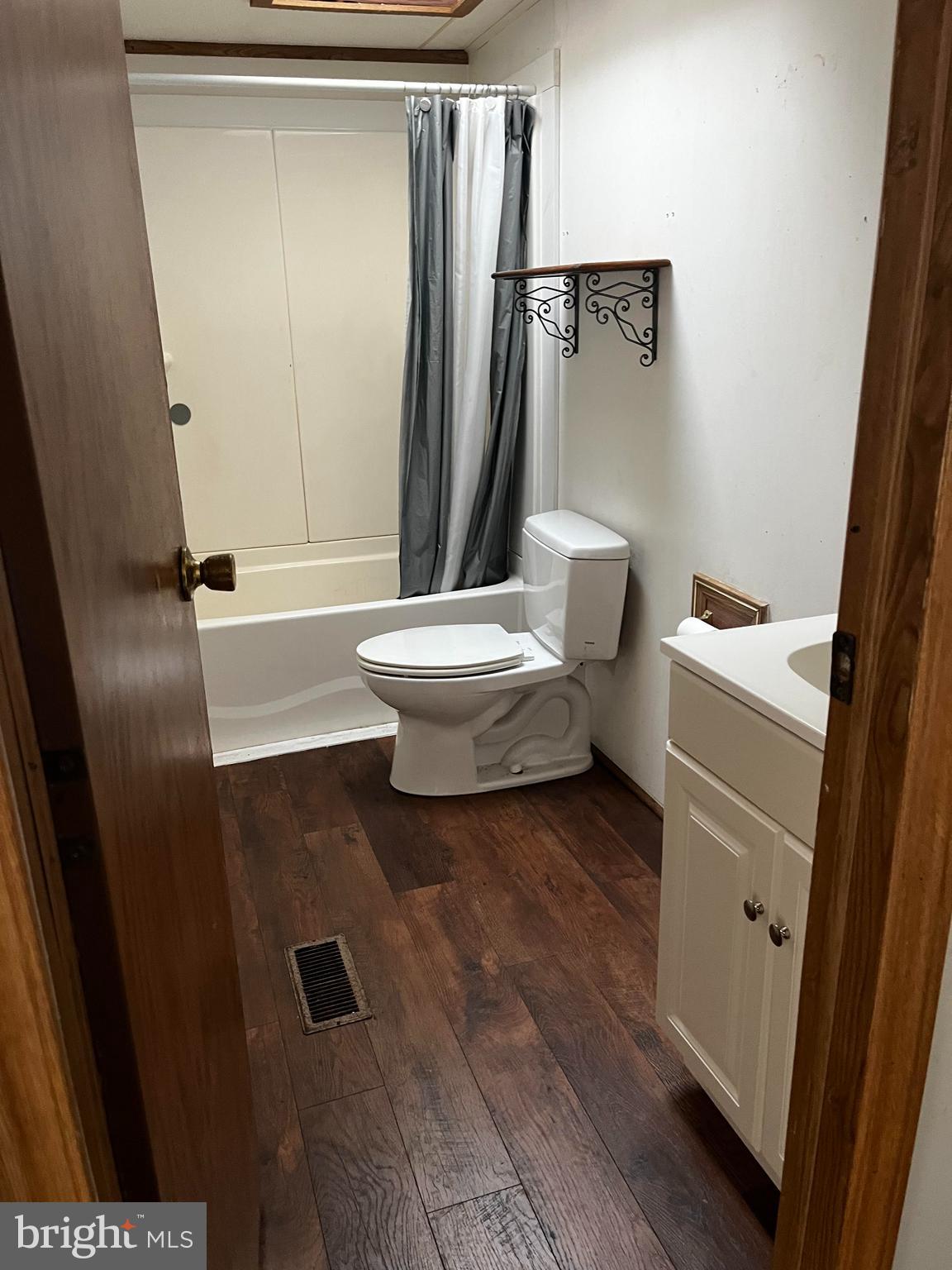 11240 Curt Dogg Road Lincoln, DE 19960 - Photo 6 of 14 a bathroom with a sink a toilet a tub and shower