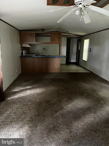 a kitchen with kitchen island a sink stainless steel appliances and cabinets
