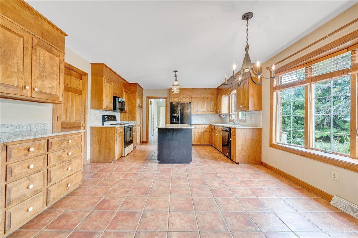 105 North Branch Road Bedford, VA 24523 - Photo 14 of 80 a large kitchen with stainless steel appliances granite countertop a refrigerator and a sink