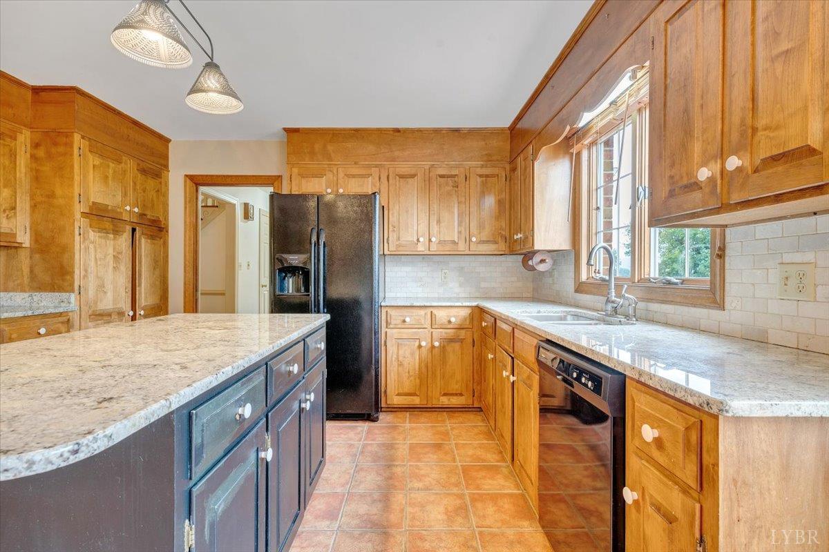 105 North Branch Road Bedford, VA 24523 - Photo 17 of 80 a kitchen with stainless steel appliances granite countertop a sink and a stove