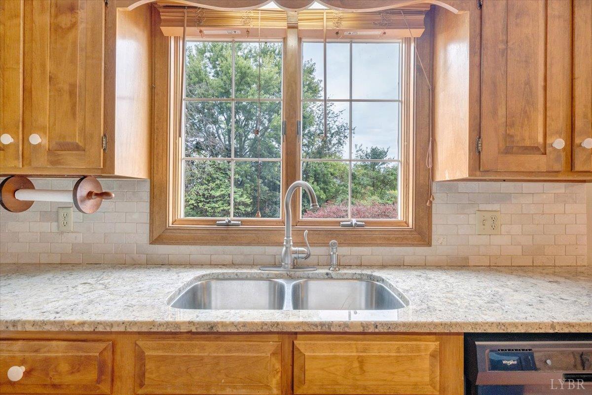 105 North Branch Road Bedford, VA 24523 - Photo 18 of 80 a kitchen with granite countertop a sink and a window