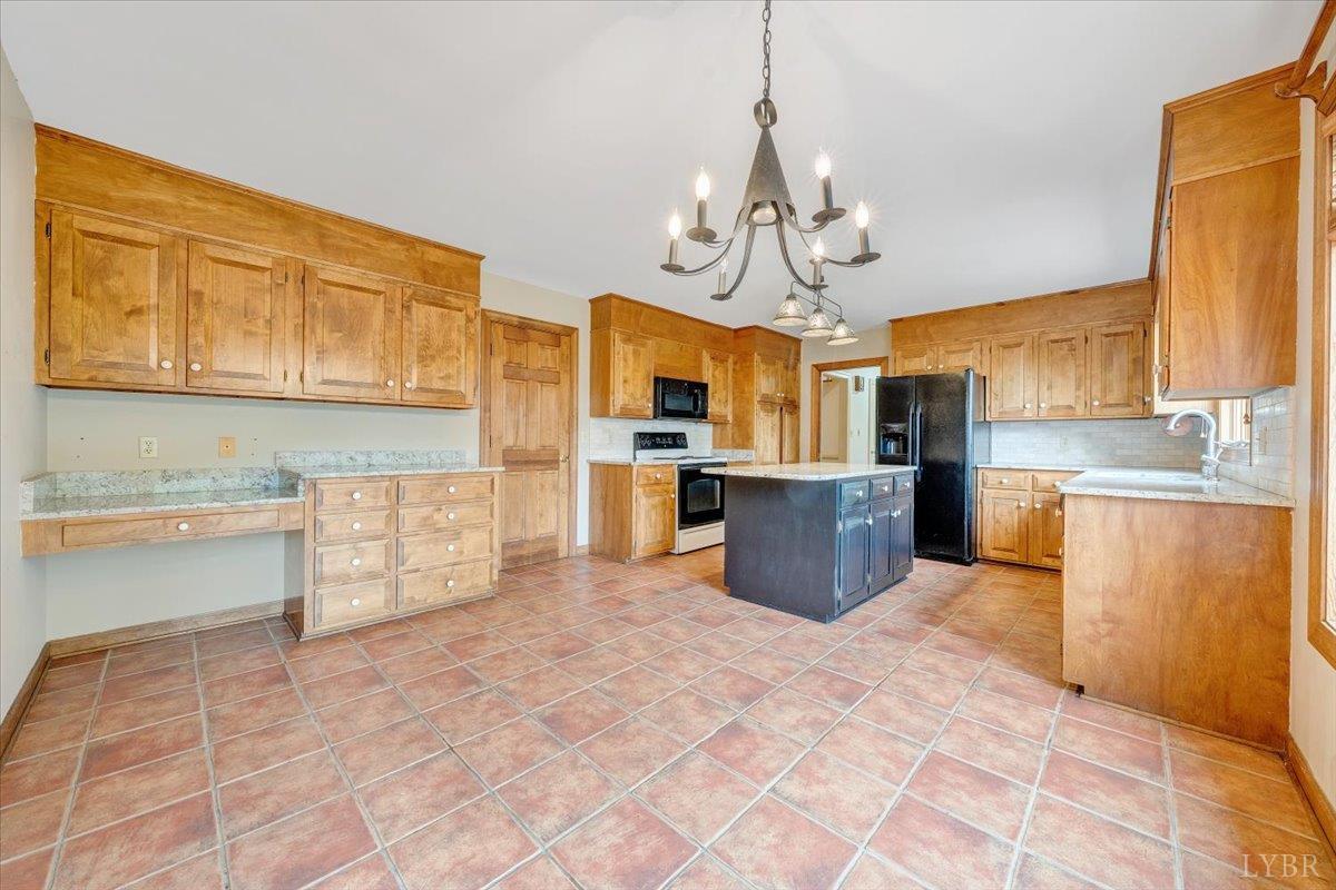 105 North Branch Road Bedford, VA 24523 - Photo 22 of 80 a large kitchen with stainless steel appliances granite countertop a stove top oven a sink dishwasher and a refrigerator with wooden cabinets