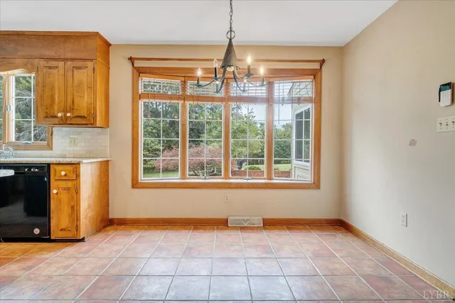 a bed room with a bed and a chair