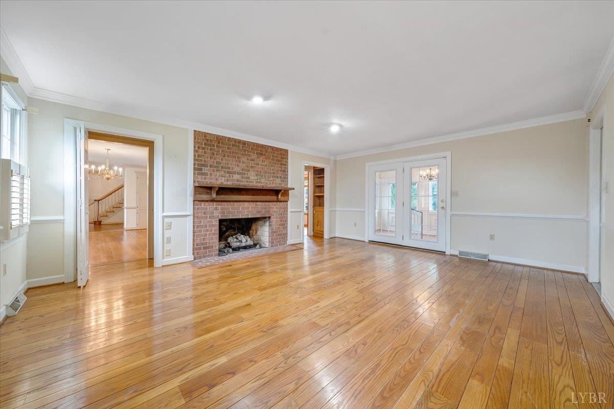 105 North Branch Road Bedford, VA 24523 - Photo 28 of 80 a view of empty room with wooden floor and fireplace
