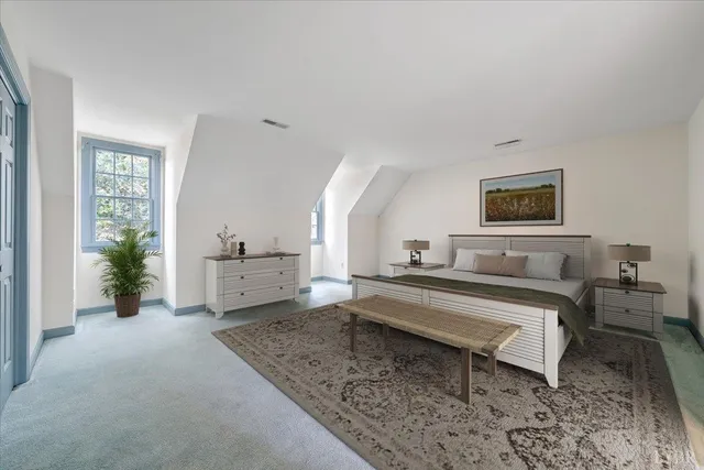 a view of a house with backyard and garden