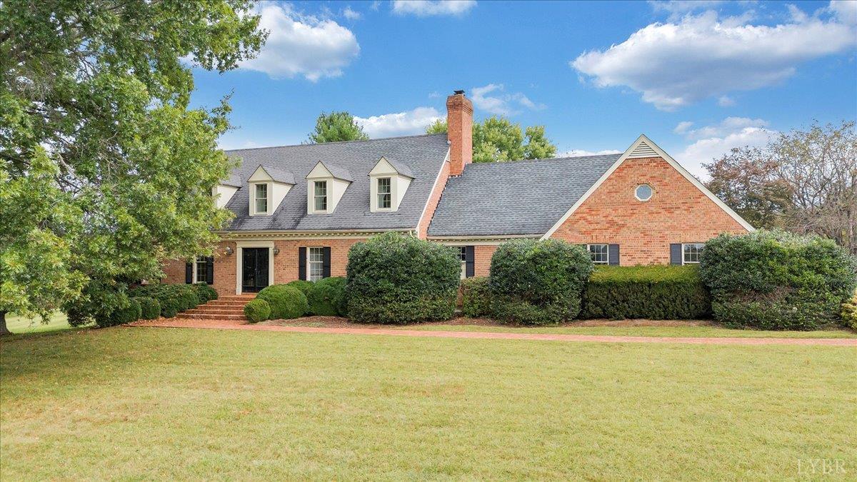 105 North Branch Road Bedford, VA 24523 - Photo 74 of 80 a front view of house with yard and trees in the background