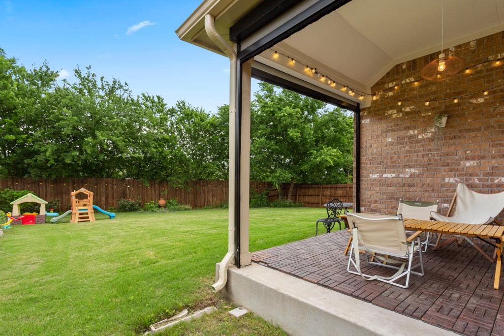 1916 Elaina Loop Leander, TX 78641 - Photo 21 of 23 a view of a chair and table in the garden and yard
