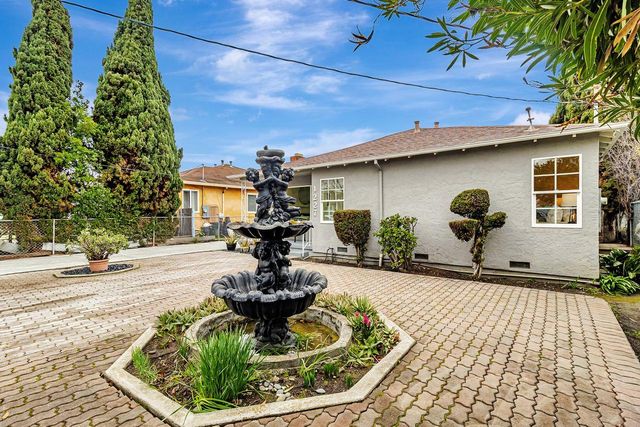 a house view with a garden space