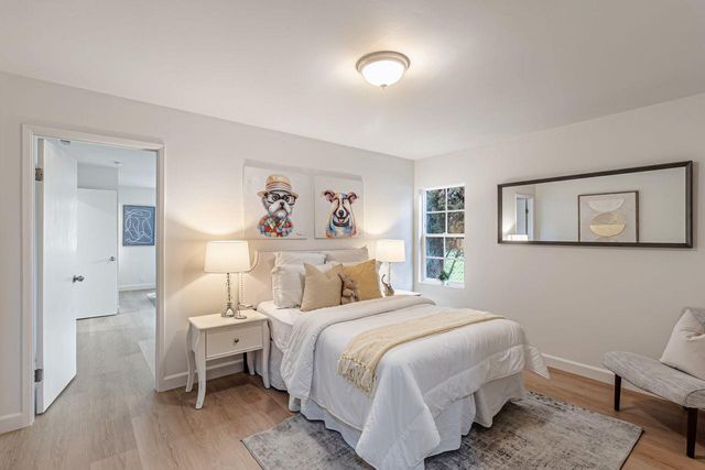 a bedroom with a bed and a chair