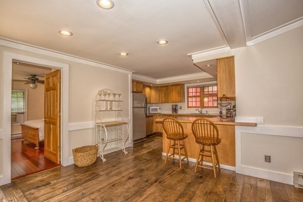 26 The Forest Road Tolland, MA 01034 - Photo 8 of 36 a view of a workspace with furniture and wooden floor