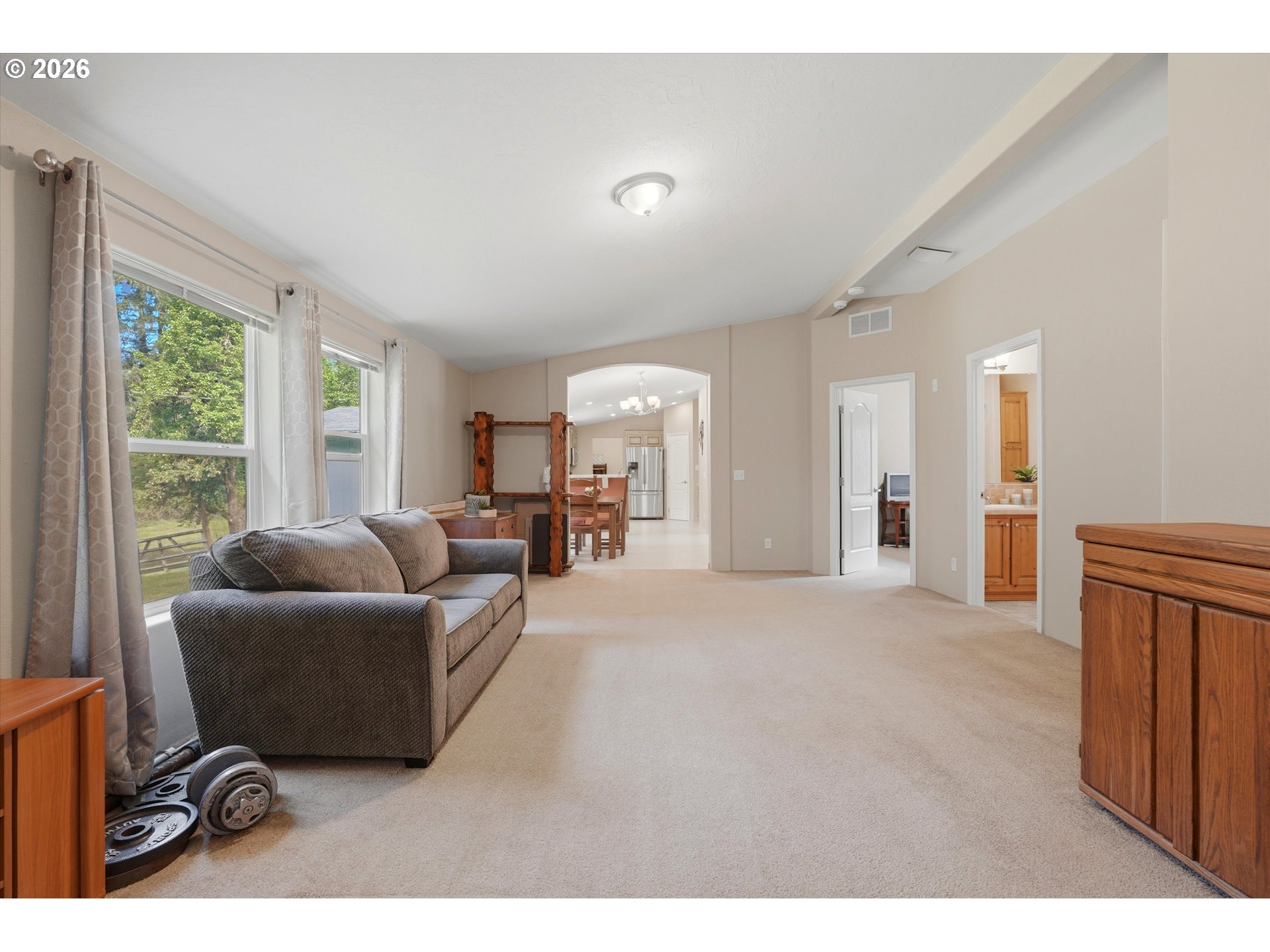 20270 Northwest Pihl Road Banks, OR 97106 - Photo 22 of 47 a living room with furniture and a large window