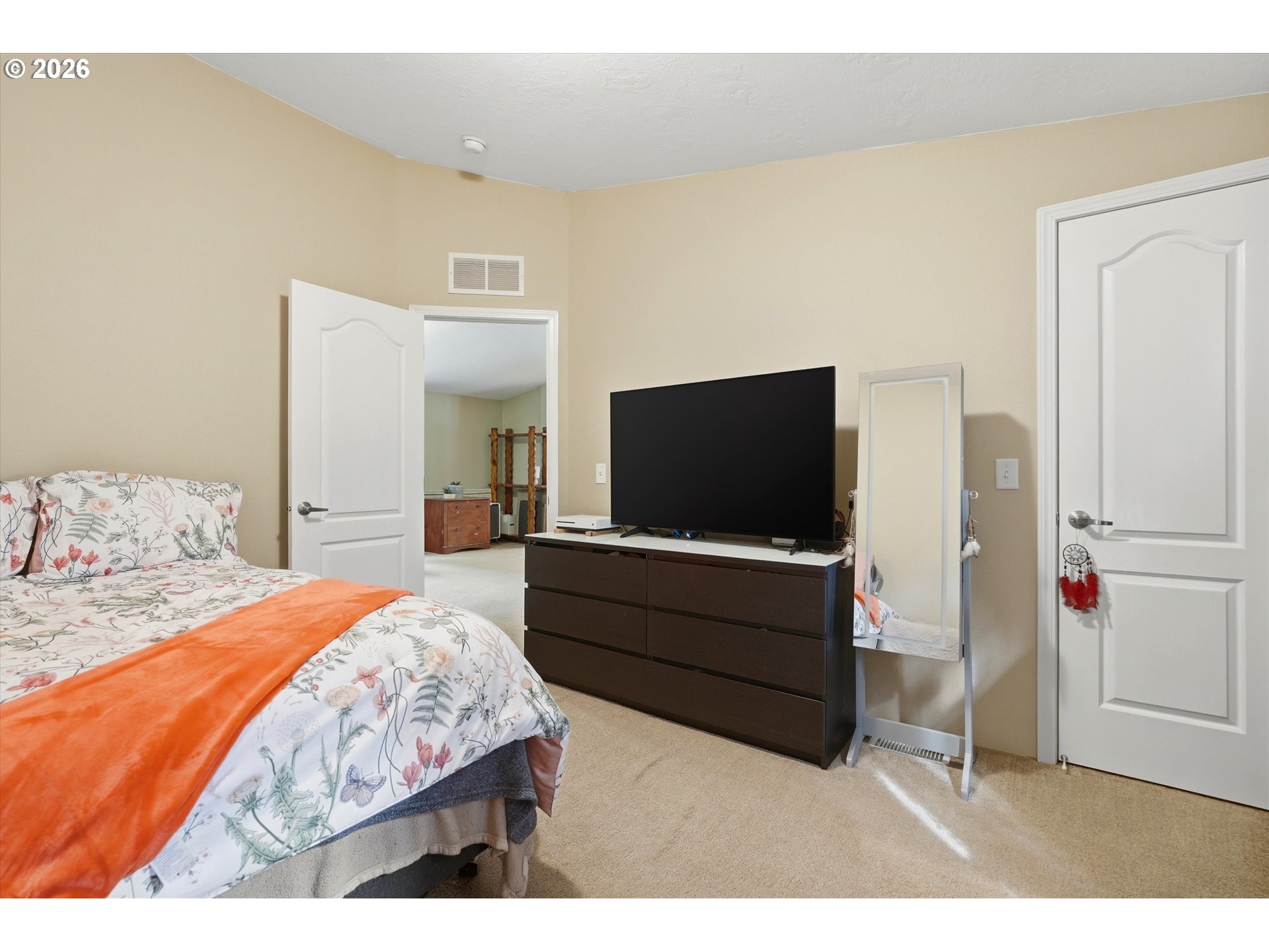 20270 Northwest Pihl Road Banks, OR 97106 - Photo 30 of 47 a bedroom with a bed and a flat screen tv
