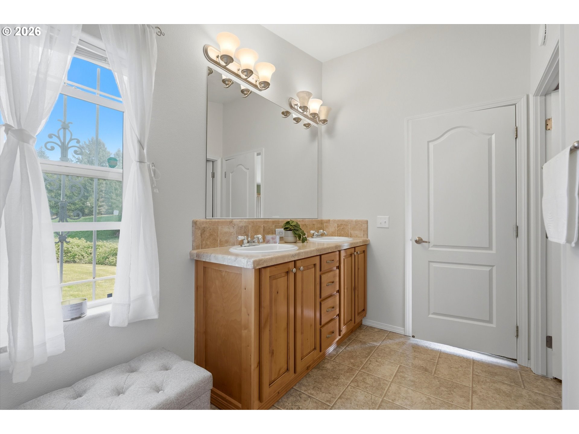 20270 Northwest Pihl Road Banks, OR 97106 - Photo 33 of 47 a bathroom with a sink a mirror and a shower