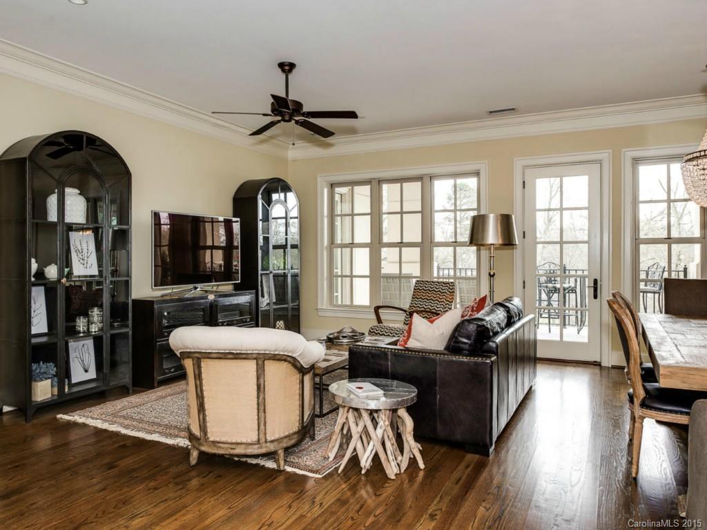 2823 Providence Road, Unit 145 Charlotte, NC 28211 - Photo 3 of 24 a living room with furniture floor to ceiling window and wooden floor