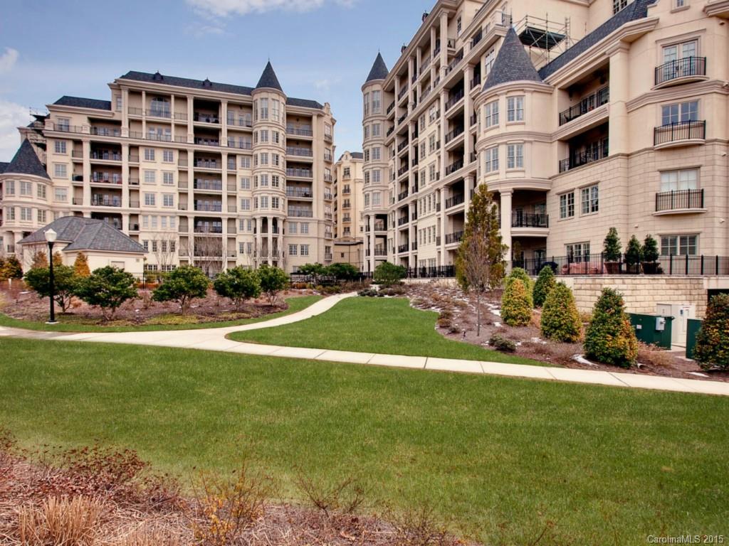 2823 Providence Road, Unit 145 Charlotte, NC 28211 - Photo 23 of 24 a view of a building with a yard