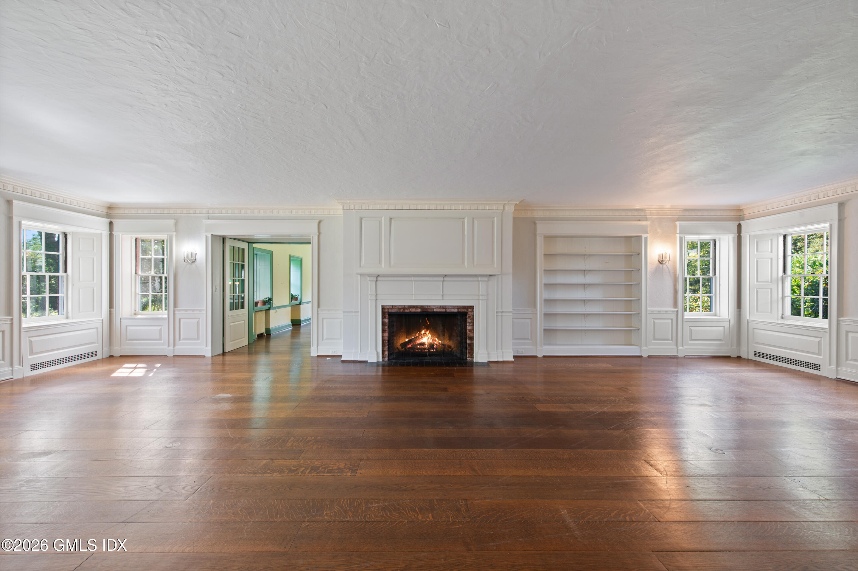 122 Round Hill Road Greenwich, CT 06831 - Photo 5 of 37 a view of an empty room with window and fire place
