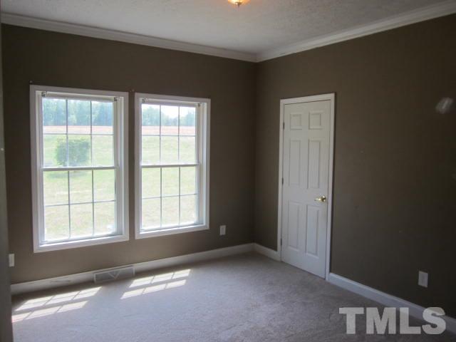 728 Woodys Store Road Roxboro, NC 27574 - Photo 13 of 15 a view of an empty room with a window