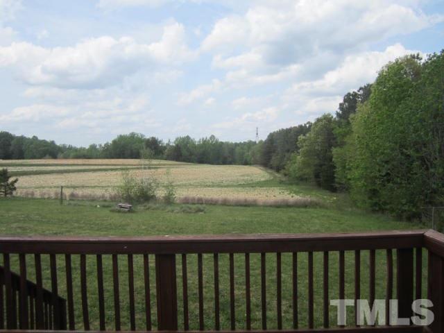 728 Woodys Store Road Roxboro, NC 27574 - Photo 3 of 15 a view of a green field with outside of the house