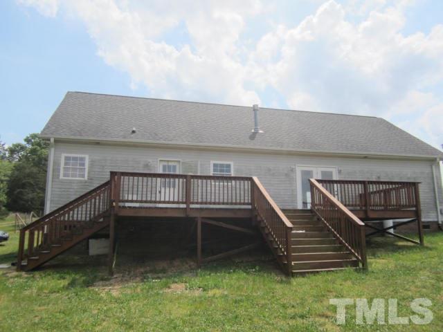 728 Woodys Store Road Roxboro, NC 27574 - Photo 4 of 15 a view of a house with a yard