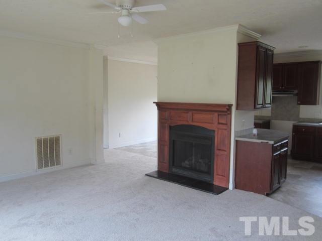 728 Woodys Store Road Roxboro, NC 27574 - Photo 5 of 15 a living room with furniture and a fireplace