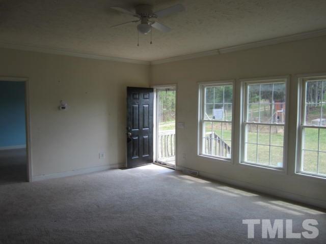 728 Woodys Store Road Roxboro, NC 27574 - Photo 6 of 15 an empty room with windows