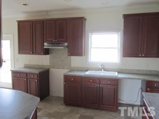 728 Woodys Store Road Roxboro, NC 27574 - Photo 8 of 15 a kitchen with a sink stove and cabinets
