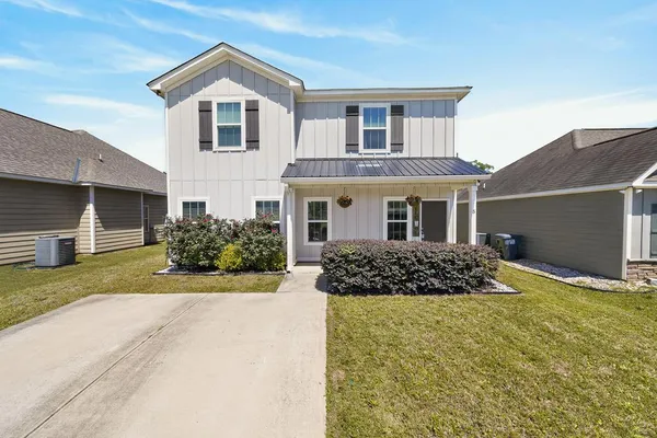 a front view of a house with a yard