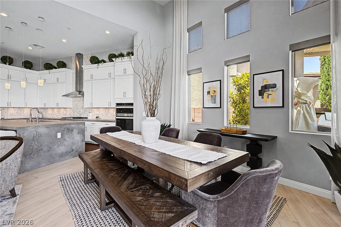 6014 Willow Ridge Court Las Vegas, NV 89135 - Photo 24 of 99 This open concept space seamlessly connects a functional kitchen with an inviting dining area.