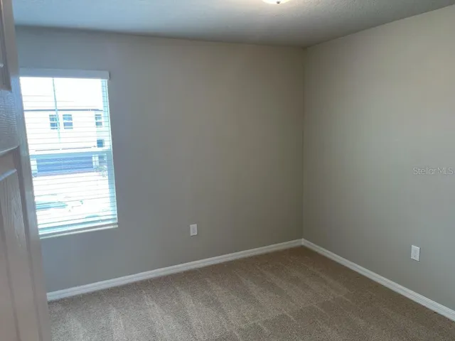 a view of front a house with yard outdoor seating and garage