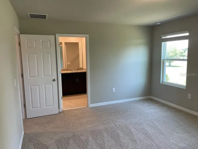 a view of a backyard with of trees