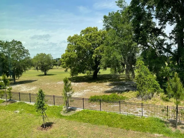 a view of a table and chairs in the garden