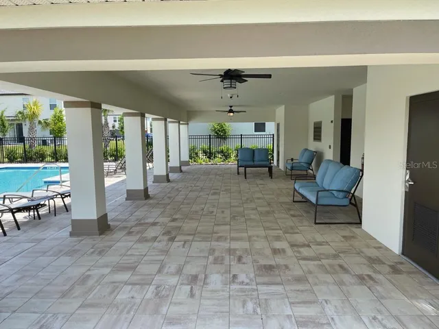 a view of a building with sitting area