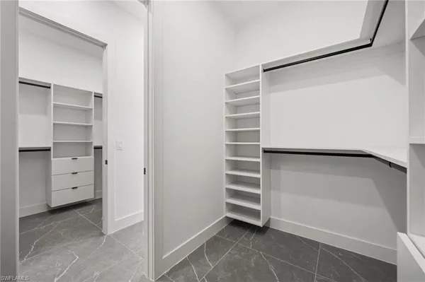 a view of an empty room with a fan