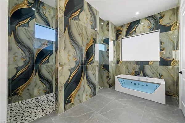 an empty room with a ceiling fan and carpet