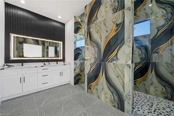 a bathroom with a sink and a mirror