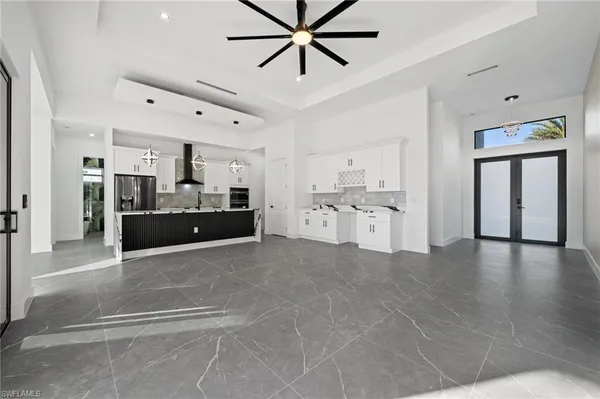 a view of a kitchen with a sink and cabinets