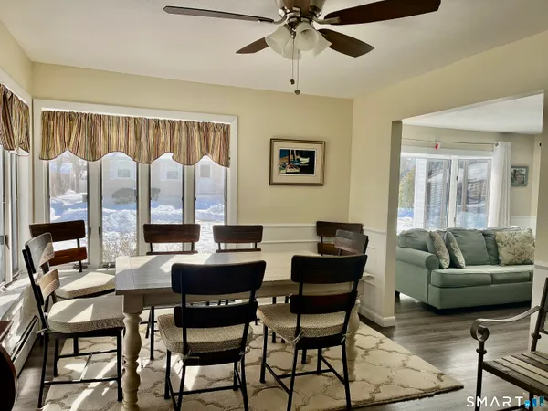 a view of a livingroom with furniture and a large window