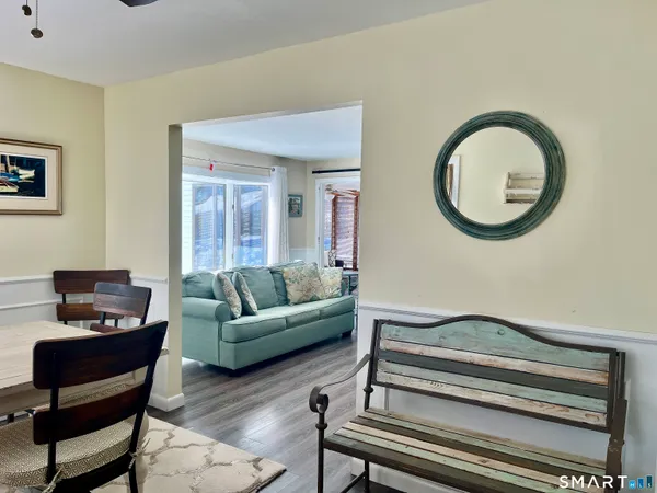a living room with furniture and a piano