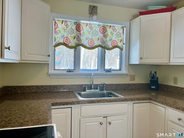 a kitchen with a sink and cabinets