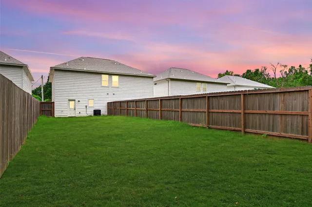 a view of a backyard with a small cabin