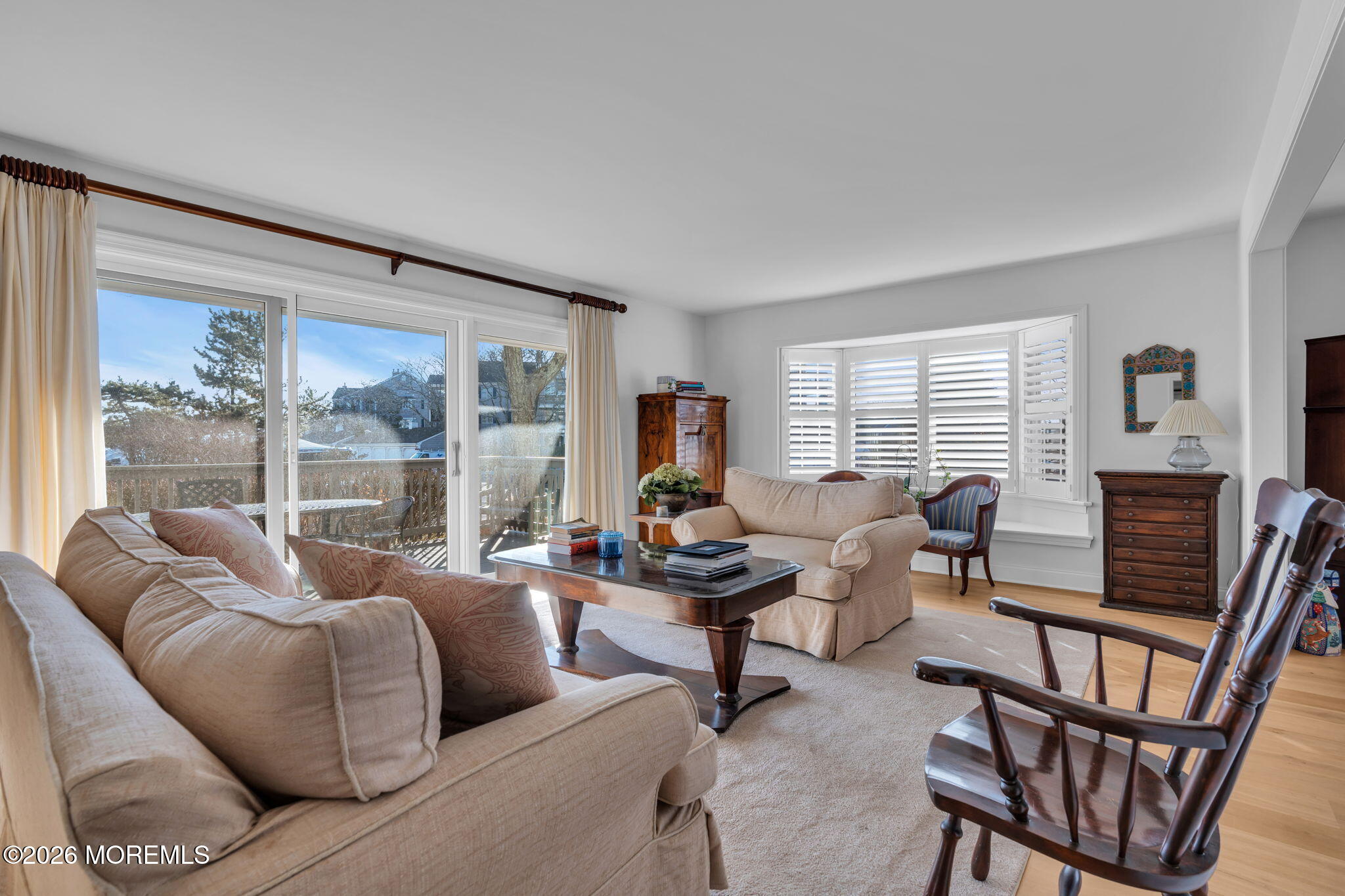 97 Bay Point Harbour Point Pleasant, NJ 08742 - Photo 19 of 54 a living room with furniture a fireplace and a floor to ceiling window