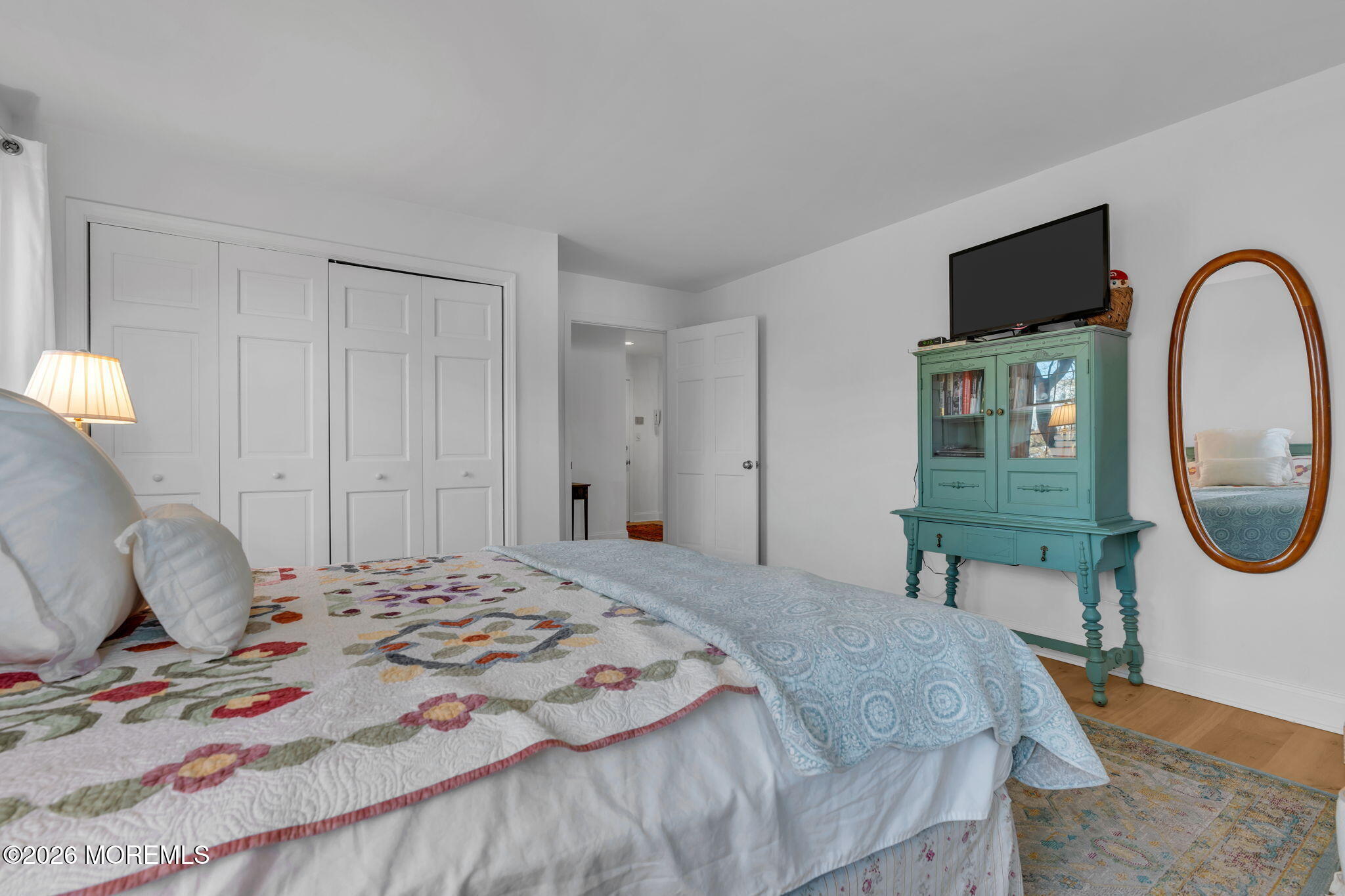 97 Bay Point Harbour Point Pleasant, NJ 08742 - Photo 30 of 54 a bedroom with a bed a mirror and a flat tv screen on the dresser