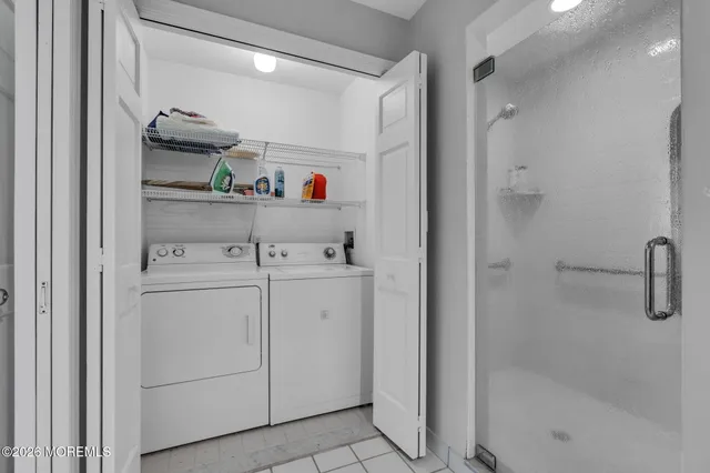 a view of a roof deck with table and chairs and wooden floor