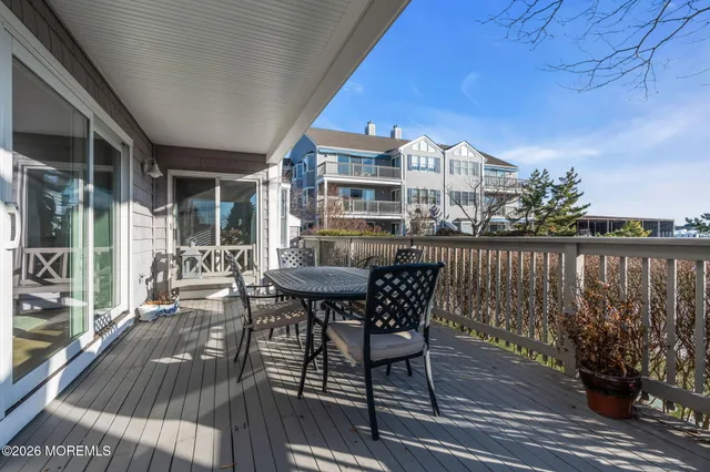 a view of a patio with table and chairs and potted plants